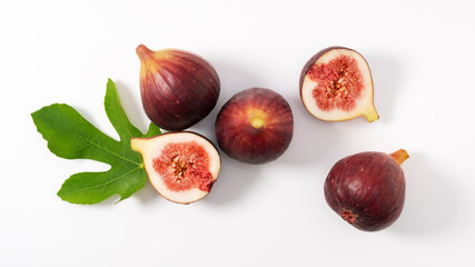 Figs and cut figs on a white background.