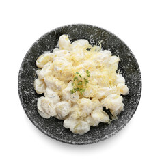 Bowl of delicious gnocchi with creamy sauce on white background