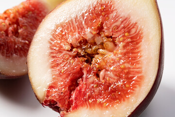 Cut figs on a white background.