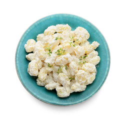 Plate of delicious gnocchi with creamy sauce on white background