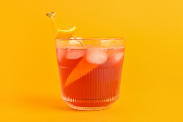 Glass of tasty Negroni cocktail on color background