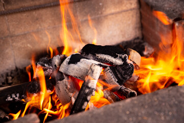 Firewood burning fire and hot orange flames