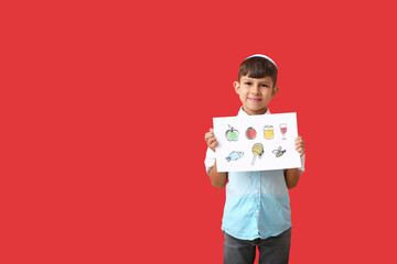 Little boy holding paper with drawings for Rosh Hashanah (Jewish New Year) on color background