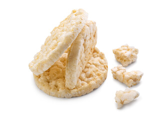 Broken puffed rice crackers on white background