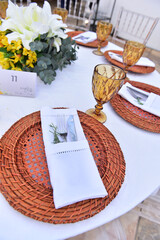 wedding table setting with flowers, banquet, table set with rustic sousplat, lunch table with white roses, ornamental flowers, top view, table set