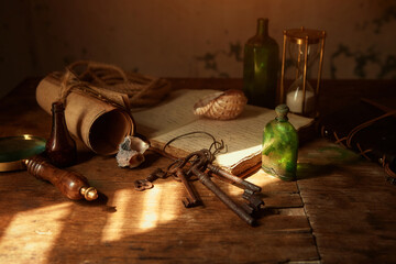 On the old table are: an old book, manuscripts, bottles for potions and poisons, a seashell, a...