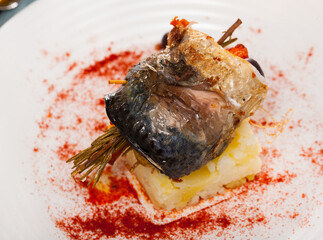 Rolls-up of fillet of mackerel with olives and rosemary. High quality photo