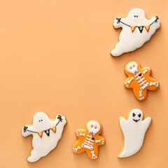 Tasty cookies for Halloween celebration on color background