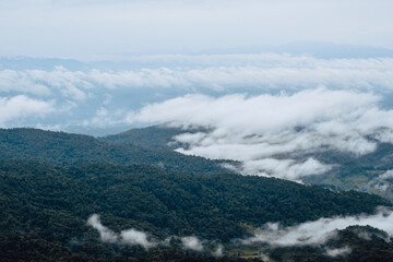 Mountain hills with morning fog and white mist.