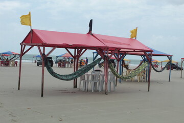 Shelters with hammocks on Aracaji beach, São José de Ribamar, Maranhão, Brasil