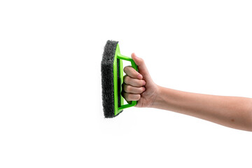 Close up human hand holding a green plastic scrubber isolated on white background.