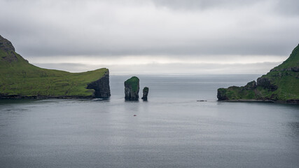 Fototapeta na wymiar Beautiful aerial view of Drangarnir, the sea stacks between the islet Tindholmur in the Faroe Islands