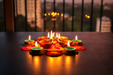 Diwali celebration Indian festival of lights Diya oil lamp and colors Rangoli decoration bright...