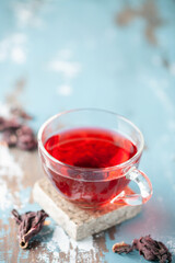 Red tea carcade in glasses and dried hibiscus flowers. Copy space