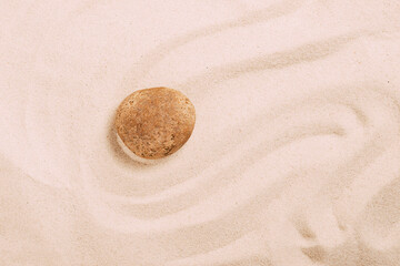 Fototapeta na wymiar Beach sand sand wave pattern stone zen. Abstract sand texture. The concept of spiritual harmony of beauty