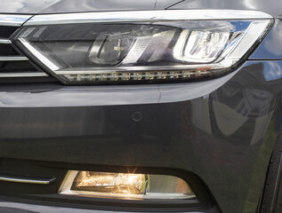 Economical and modern car headlight with LED adaptive light. Close-up, illuminate