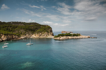 Beautiful beach with very clean and azure water on the mediterranean sea in the island of Ibiza, Spain