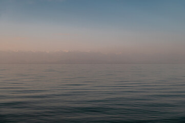 pink haze over the serene lake waters