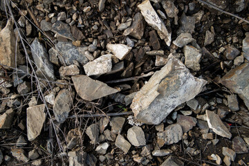 Crushed stone texture. Broken stones background. Dark grunge