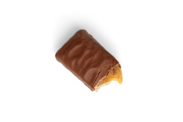 Broken chocolate bar with nougat and caramel isolated on white background.