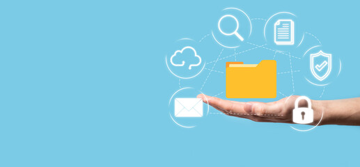 Document Management System DMS .Businessman hold folder and document icon.Software for archiving,...
