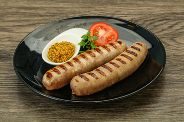Grilled natural pork sausages with sauce
