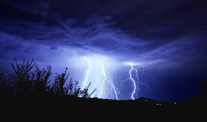 A Monsoon Lightning Storm has numerous strikes, and turns the night blue.