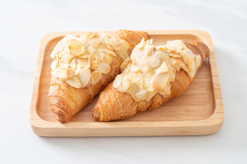 croissant with cream and almonds
