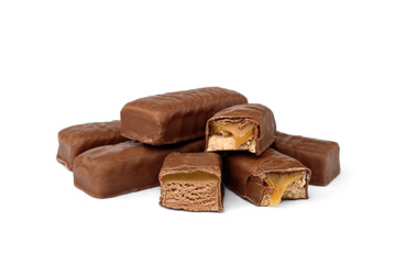 Pile of chocolate sweets with nougat, caramel and nuts isolated on white background.