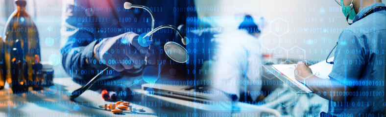 Serious old mature professional male doctor using laptop computer in hospital office watching...