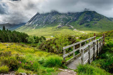 Along the West Highland Way. A wooden walkway at the foot of Devil's stair - 458183221