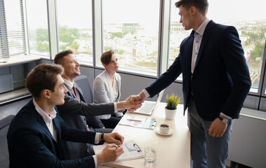 Job applicant having interview. Handshake while job interviewing