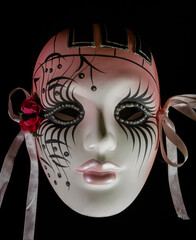 Mardi Gras mask of female made of painted ceramic with textile detail