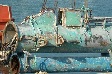 Two metal pipes in the port before repair