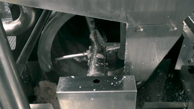 Fish factory. Making fish farm on a large automatic machine. Pollock mince.