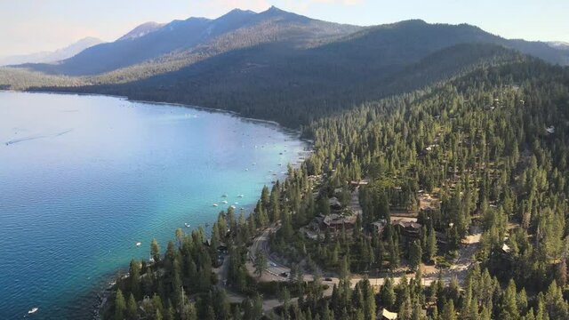 Drone flying towards McKinney Rubicon Trailhead while shadows dance across the ridge