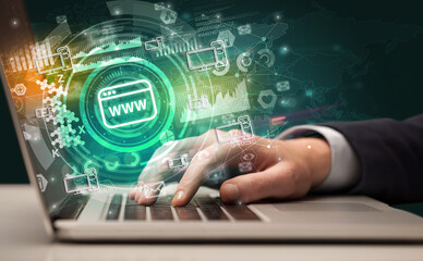 Business hand typing on a modern laptop