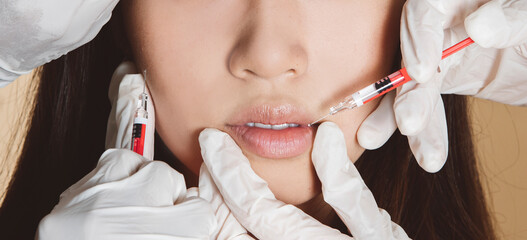 Plastic surgery. Asian young woman receiving botox injection in criss-cross zone at beauty clinic