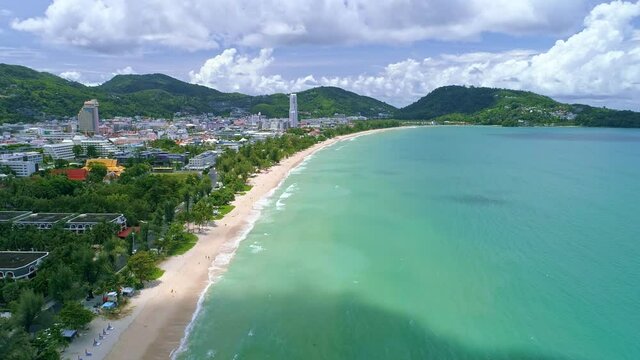 Aerial view Drone camera flying over Patong city Phuket Thailand in the morning Beautiful patong beach in summer season