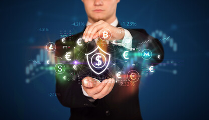 Businessman holding currency symbols concept