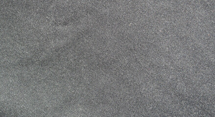 Gray surface and grunge background of the fabric is old and torn, Textile texture for add text or graphic design	
