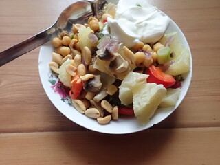 warm vegetable saladwith olives and mushrooms