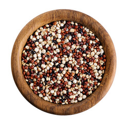 Black, red and white quinoa grains in wooden bowl isolated on white background.