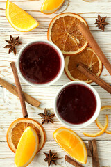 Cranberry sauce and ingredients on white wooden background