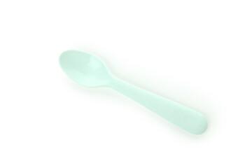 Single plastic spoon isolated on white background