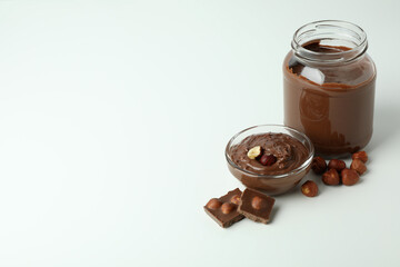 Concept of delicious food with chocolate paste on white background