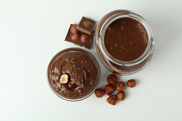 Concept of delicious food with chocolate paste on white background