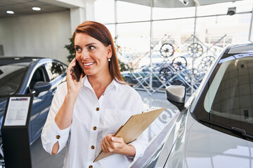 Busy day for the worker of luxurious car dealership