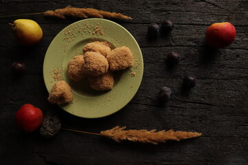 traditional rustic autumn dessert with plums and breadcrumbs