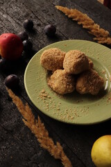 traditional rustic autumn dessert with plums and breadcrumbs